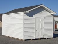 Custom Front Entry Peak Shed with White Vinyl Siding from Pine Creek Structures